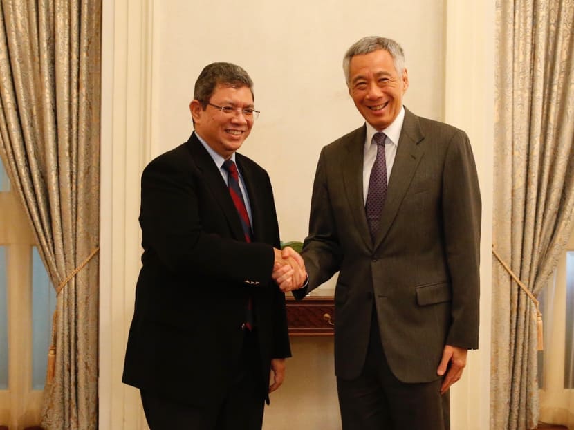 Malaysian Foreign Minister Saifuddin Abdullah and Prime Minister Lee Hsien Loong at the Istana on Monday, July 30, 2018. Malaysian Foreign Minister Saifuddin Abdullah and Prime Minister Lee Hsien Loong at the Istana on Monday, July 30, 2018.