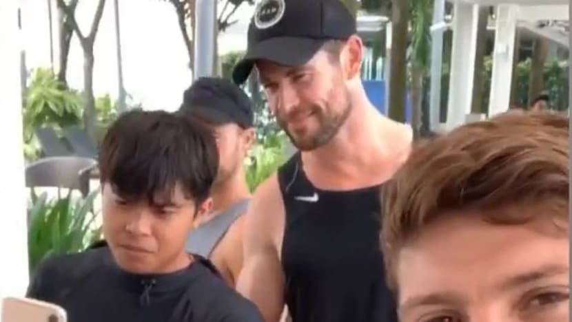 Chris Hemsworth can't walk very far in Singapore without stopping for fans