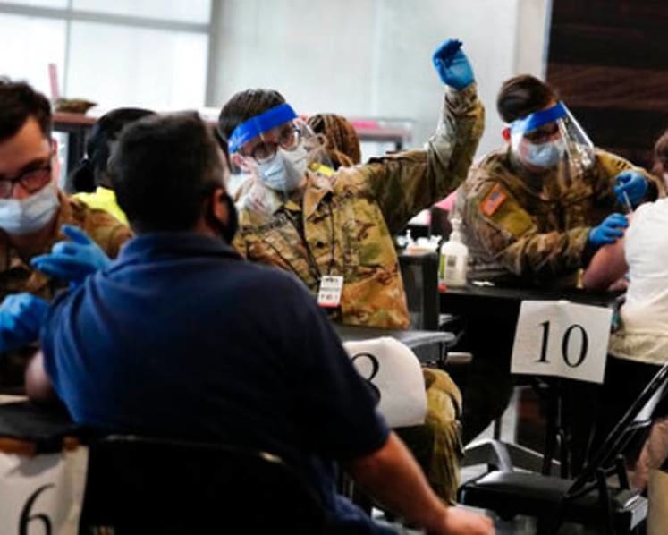 Half of US adults have received at least one COVID-19 shot