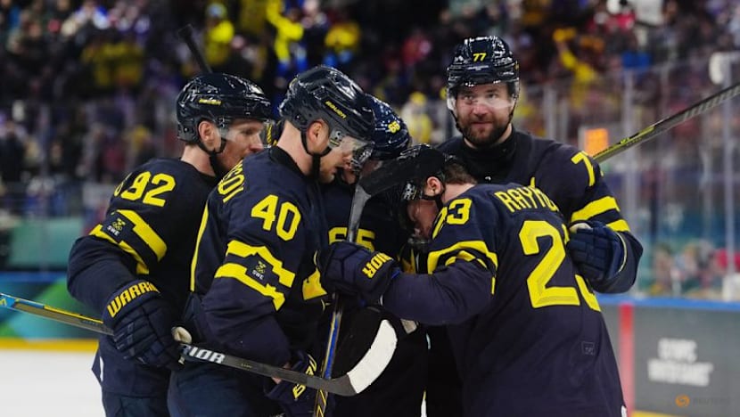 Ice hockey-Sweden hold off Slovakia, Latvia beat Germany