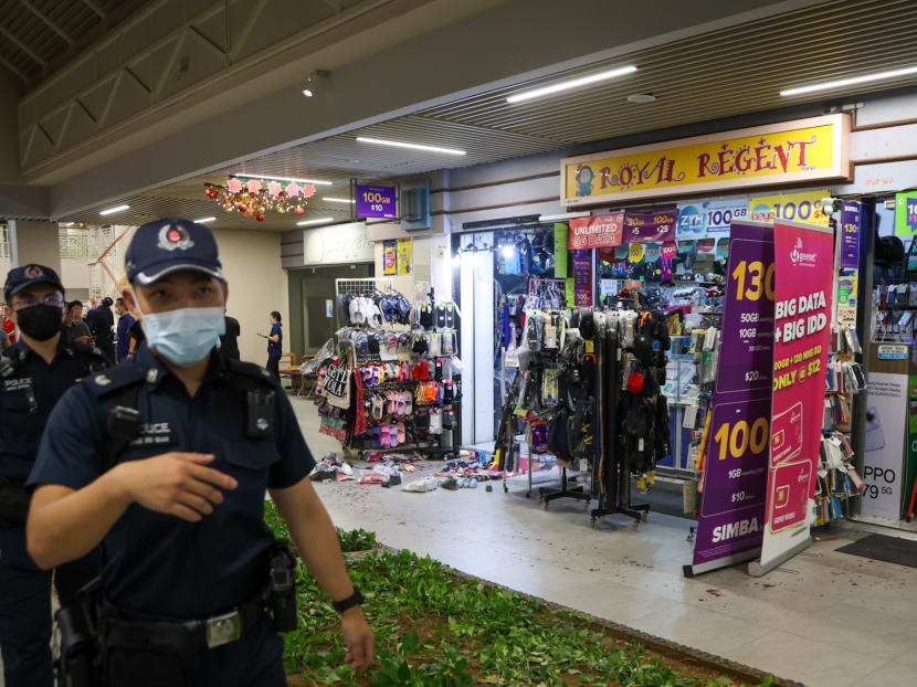 Police officers outside a shop at Block 734 Pasir Ris Street 72 where an alleged slashing incident took place on Dec 20, 2023.