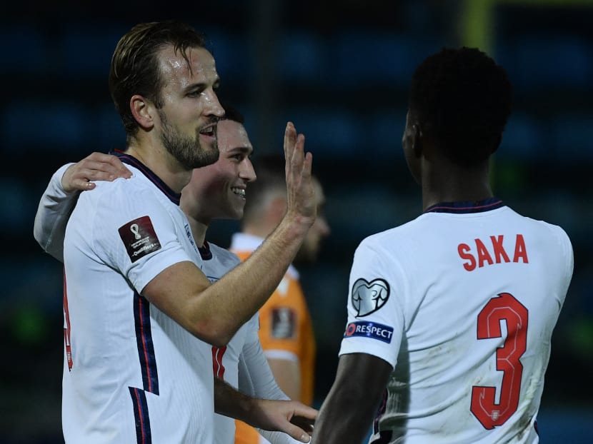 England captain Kane (left) took centre-stage in the emphatic win, scoring four before the break to rewrite the record books.