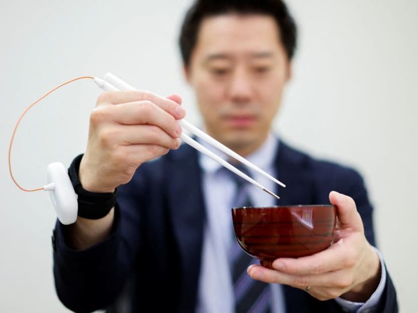 The chopstick's job is to deliver an extremely mild, computer-controlled electrical current when a circuit is completed by the lips, tongue and the food itself. The chopstick's job is to deliver an extremely mild, computer-controlled electrical current when a circuit is completed by the lips, tongue and the food itself.
