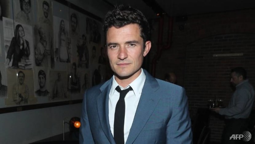 Actor Orlando Bloom mourns dead dog with a tattoo of its name on his chest