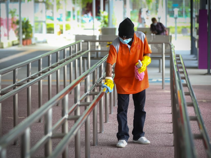 A cleaner cleaning surfaces at Tampines Concourse Bus Interchange, Sept 2, 2021.