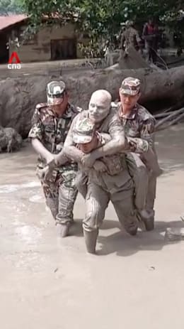 Nepali soldiers seen carrying flood victims to safety