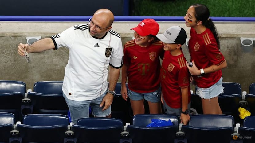 Rain sends Germany and Curacao fans on pre-match hunt for umbrellas and beer
