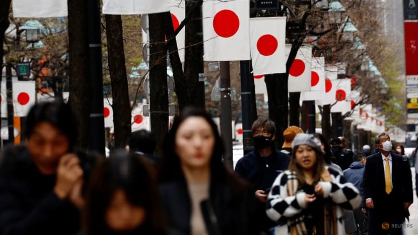 Japan business mood improves slightly, global risks cloud outlook