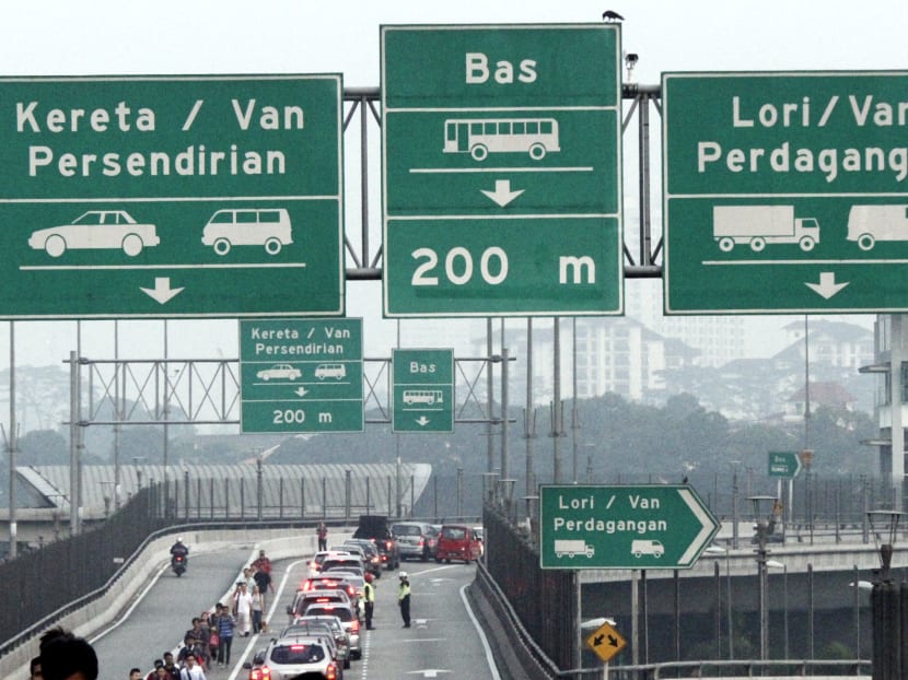 After delays of more than six months, Malaysia will impose an entry permit for Singapore vehicles. TODAY file photo