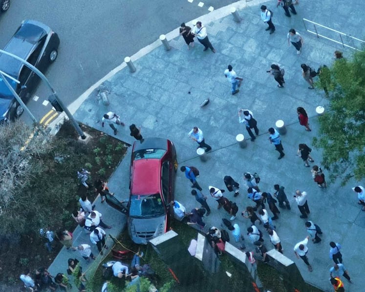 Four people in hospital after car mounts pavement at Marina Bay Financial Centre; driver arrested