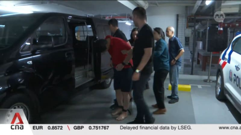 Indonesian accused of murdering his wife in Singapore hotel brought back to crime scene