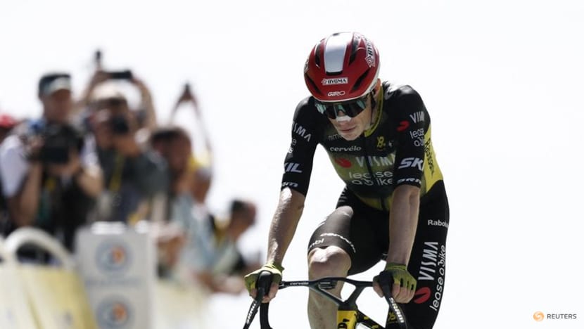 Vingegaard hits deck after being jostled by photographer post-finish