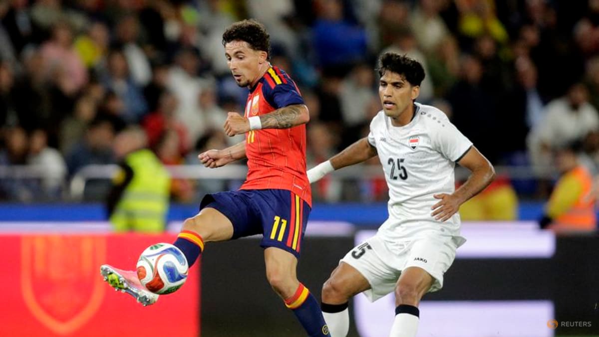 Second-string Spain held by Iraq in low-key World Cup send-off