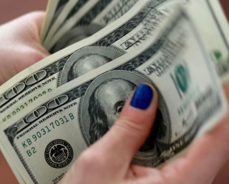 US dollar retreats as prospect of Fed rate cuts overshadows growth data