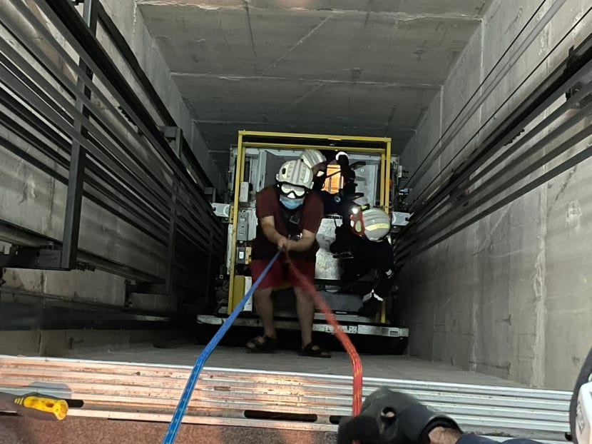 One of the trapped men being raised up a lift shaft by rescuers on April 26, 2022. 
