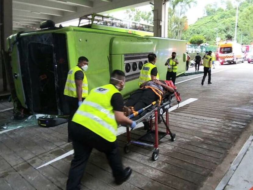 SCDF personnel attending to the injured after a bus collision at Bukit Batok bus interchange on July 11, 2021.