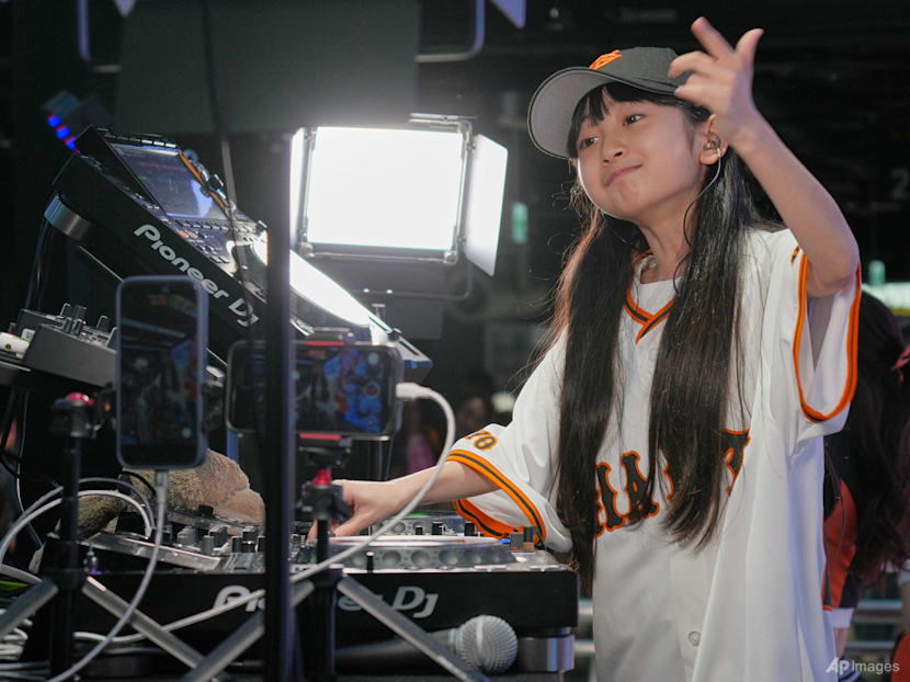 Japan's 9-year-old DJ Rinoka bobs to the beat as a child prodigy techno artist