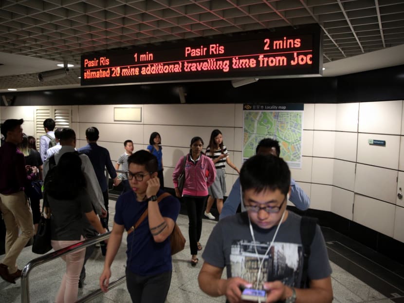 Signs indicating travel time delays at Outram Park MRT on July 12, 2017. Photo: Jason Quah/TODAY