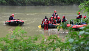 At least nine killed in southwest China after truck falls into river in heavy rain