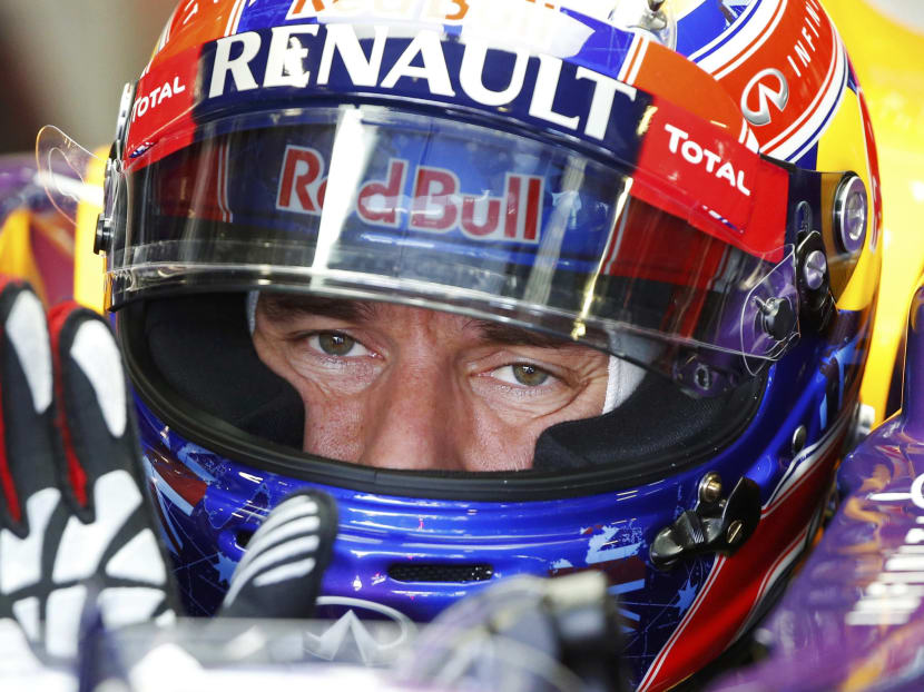 Red Bull Formula One driver Mark Webber of Australia sits in his car at the first practice session of the Italian F1 Grand Prix at the Monza circuit on Sept 6, 2013. Photo: Reuters
