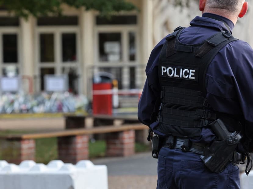 A French police officer patrols in front of the Gambetta high school during its' evacuation after a bomb threat in Arras, northeastern France on Oct 16, 2023, three days after a teacher was killed and two other people were severely wounded on Oct 13, in a knife attack at the Gambetta high school. A French police officer patrols in front of the Gambetta high school during its' evacuation after a bomb threat in Arras, northeastern France on Oct 16, 2023, three days after a teacher was killed and two other people were severely wounded on Oct 13, in a knife attack at the Gambetta high school.