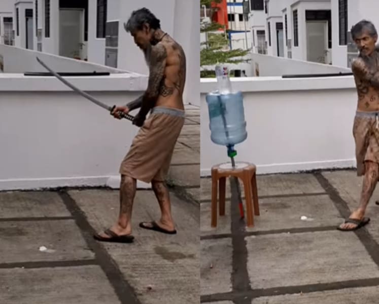 Man who posted video of himself slicing bottle with samurai sword charged