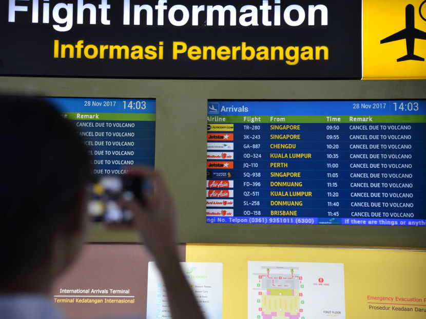 A flight information board shows the list of delayed flights due to the volcano at the Ngurah Rai International airport in Bali. AFP photo