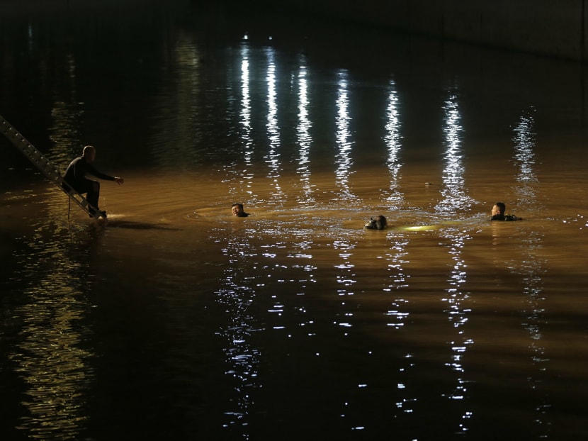 2 women killed after car plunges into Singapore River