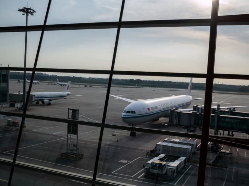 An Air China plane sits on the tarmac at terminal three in Beijing's Capital International Airport.