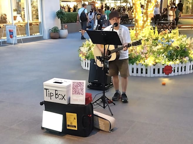 What’s it like to be a busker in Singapore? Chicken nuggets, a bucket list dream and performing on the streets