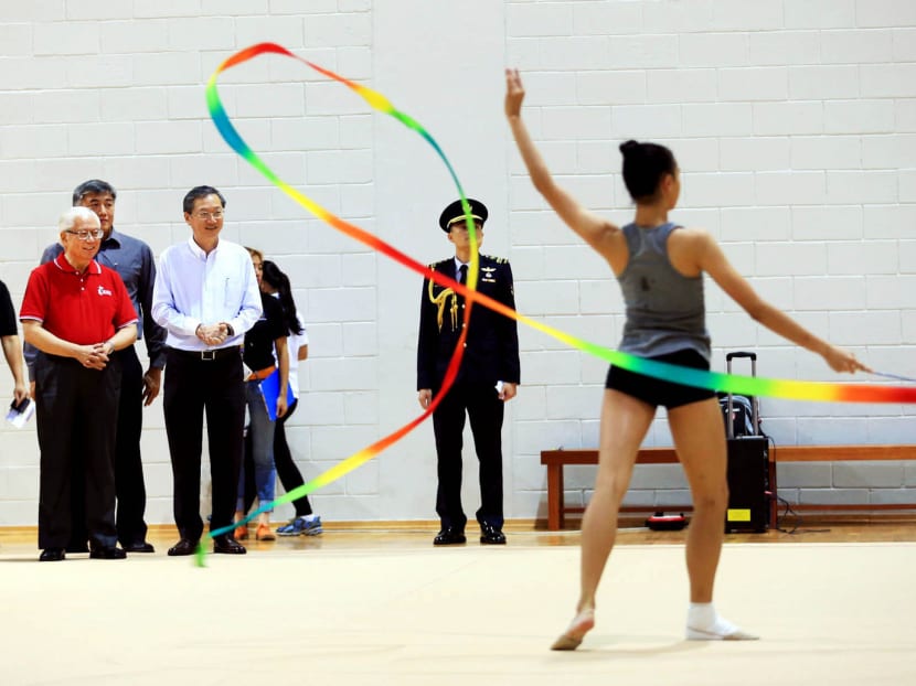 President Tony Tan watching the rhythmic gymnastics team practice during a visit to the Singapore Sports Hub yesterday. Photo: Wee Teck Hian
