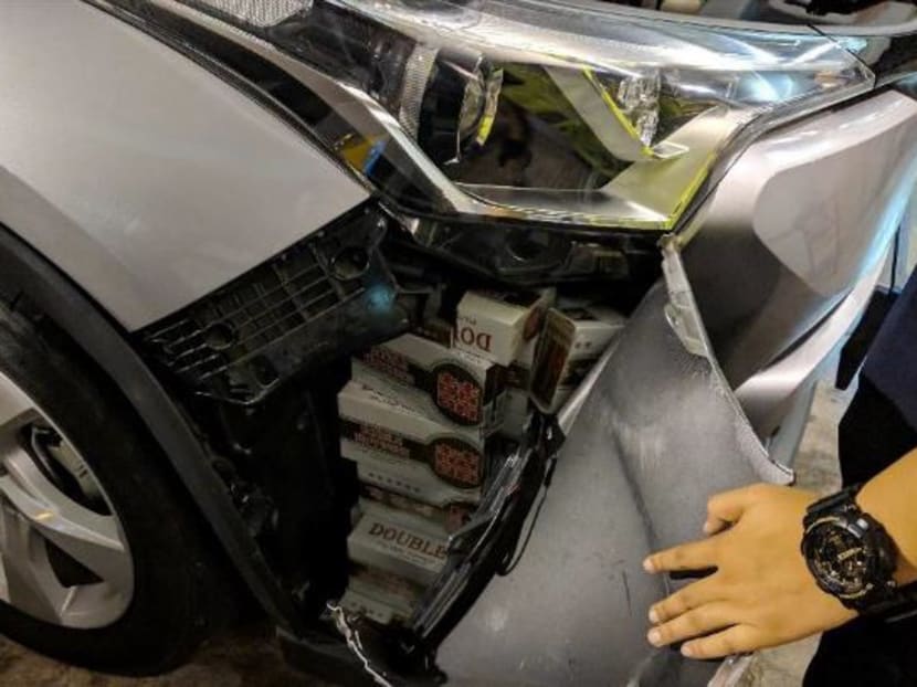 144 cartons and 1,143 packets of duty-unpaid cigarettes were found in the car Law was driving.