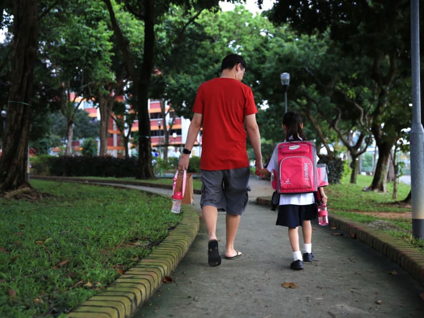 A parent sending his child to school. The Ministry of Education announced a raft of changes aimed at reducing emphasis on grades, and parents lauded the move, saying that having fewer exams will help reduce the stresses students face. A parent sending his child to school. The Ministry of Education announced a raft of changes aimed at reducing emphasis on grades, and parents lauded the move, saying that having fewer exams will help reduce the stresses students face.