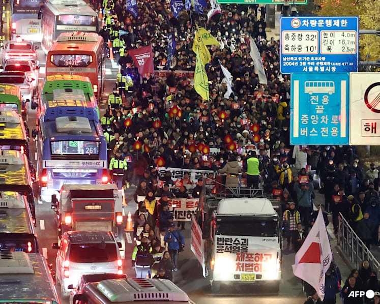 As it happened: Thousands march demanding South Korea's President Yoon resign over martial law move