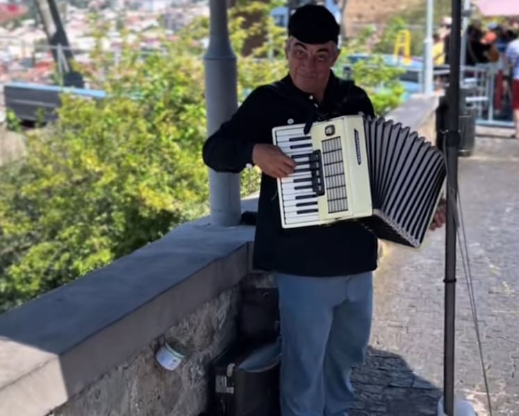Street busker in Georgia gives Singapore couple surprise treat by playing Majulah Singapura