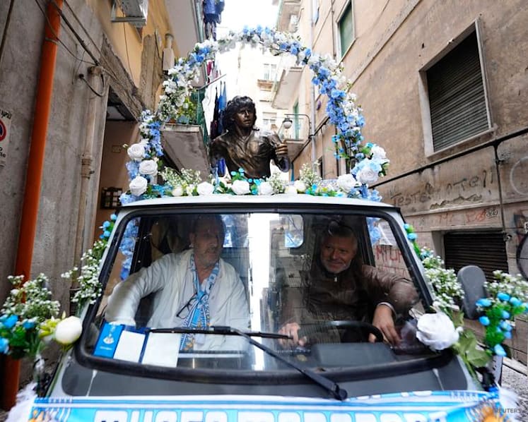 Maradona statue rides through Naples as city remembers Argentine great