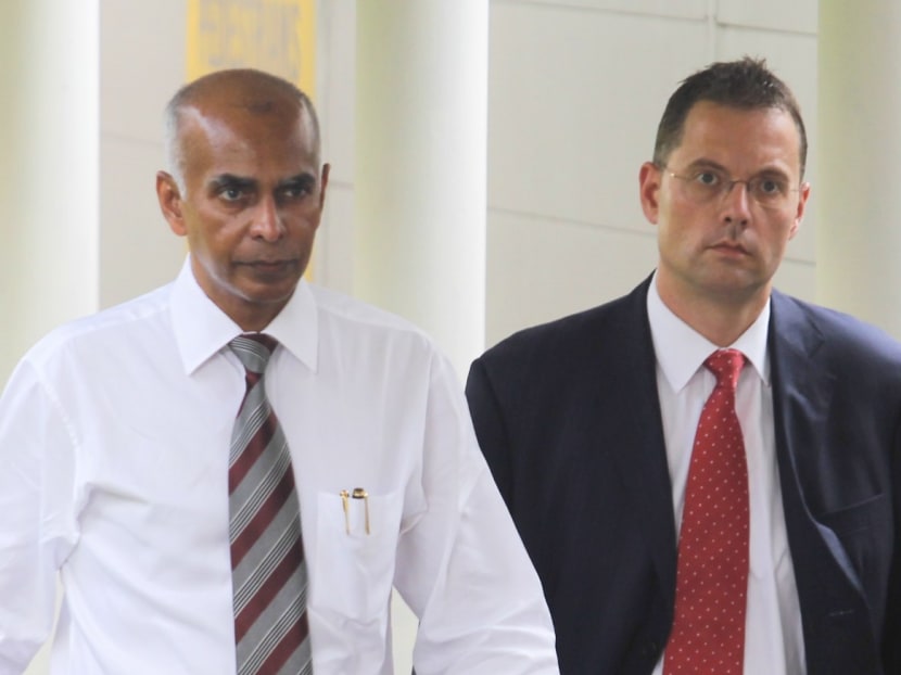 Former USB-banker Juerg Buergin arrives at court with his lawyer Selva K Naidu on March 19, 2013. The Swiss national is claiming trial for having commercial sex with a minor. Photo: Ernest Chua