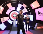 Singapore's Paul Lim, 71, becomes oldest winner of match at World Darts Championship