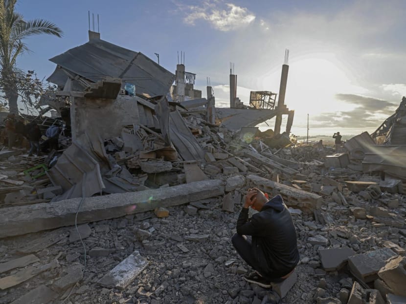 A man sits amid the debris of destroyed houses in the aftermath of Israeli bombardment in Rafah in the southern Gaza Strip on Feb 22, 2024. A man sits amid the debris of destroyed houses in the aftermath of Israeli bombardment in Rafah in the southern Gaza Strip on Feb 22, 2024.