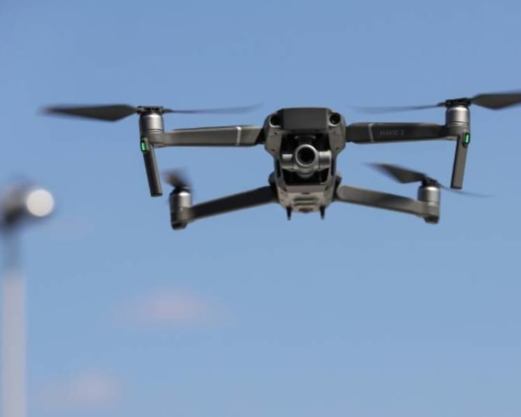 Man charged with repeatedly flying drone near MINDEF protected base, taking photos with it