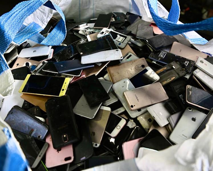 What happens to your old mobile phones after you put them in e-waste bins