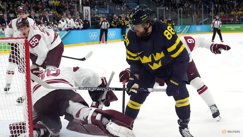 Ice hockey-Sweden beat Latvia to set men's quarter-final meeting with US