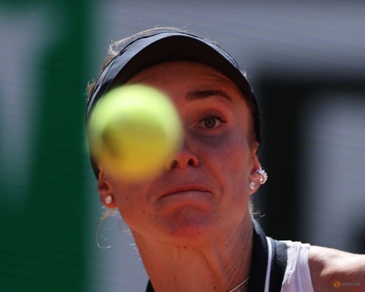 Svitolina huffs and puffs into French Open round two