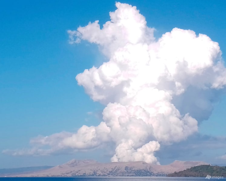 Philippine volcano spews ash and steam, evacuation under way