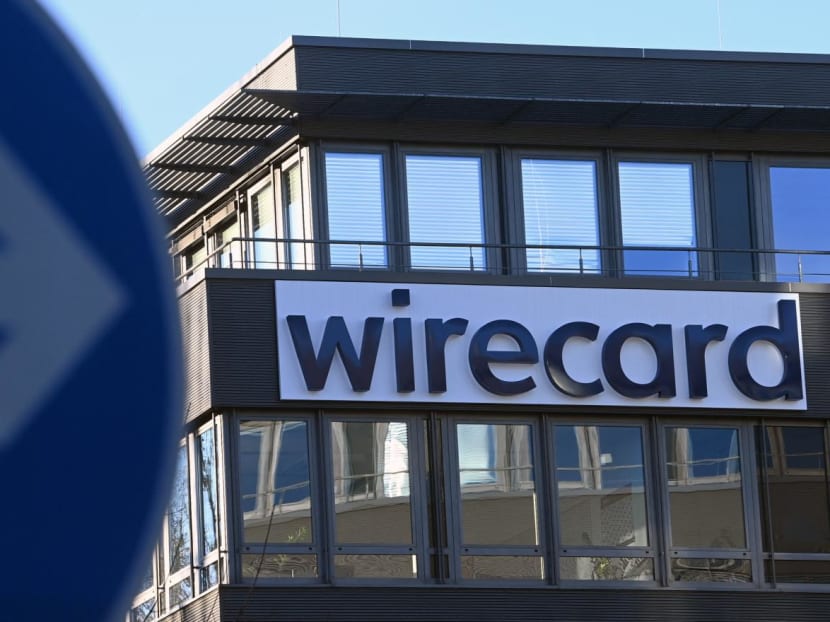 The logo of German payments provider Wirecard is seen at a building of the company's headquarters in Aschheim near Munich, Germany on Nov 18, 2020.