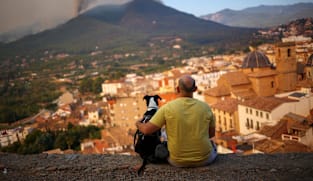 Spain lets wildfire evacuees return but France fears flames spreading    