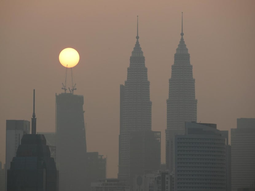 The sun rises above Kuala Lumpur's skyline on a hazy day in Kuala Lumpur, Malaysia on Oct 9, 2023.