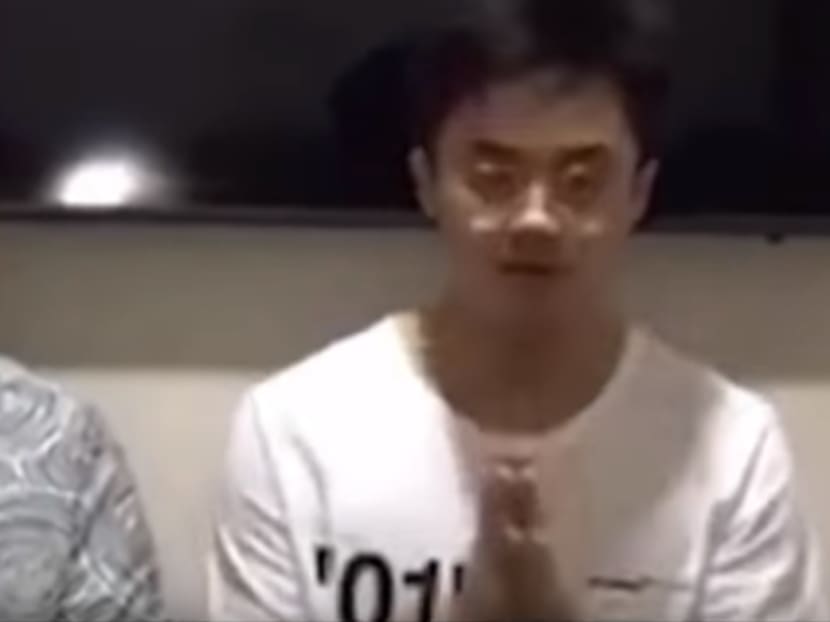 A screenshot of the video clip where Royson Jordany Tjahja (right) and his father apologised to the president and the nation.