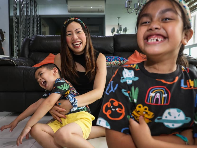 Ms Bryna Sim at home with her two children on July 14, 2022. 