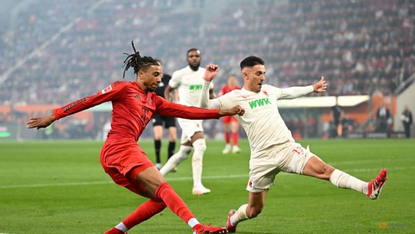 Bayern battle past 10-man Augsburg but Musiala goes off injured
